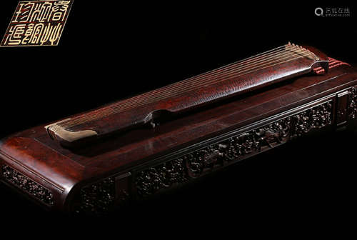 A WOOD CARVED POETRY PATTERN ZITHER