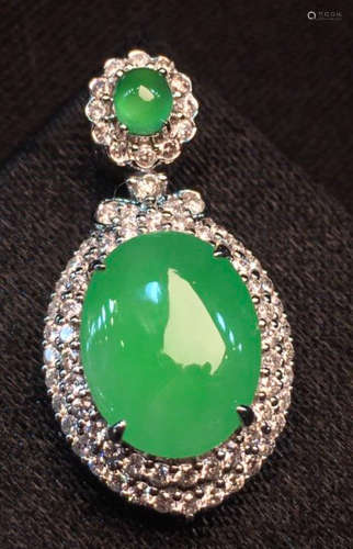 AN ICEY GREEN JADEITE CARVED PENDANT