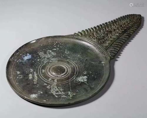 A Chinese Bronze Sawtooth Hand Mirror