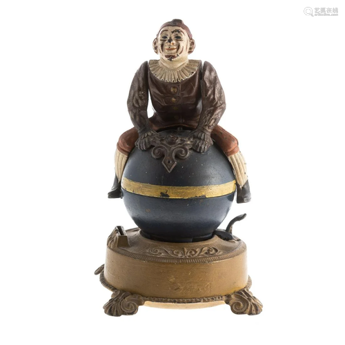 Clown on Globe Cast Iron Mechanical Bank