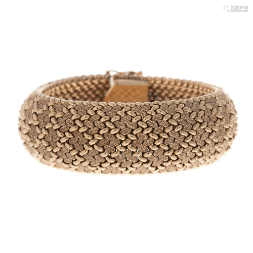 A Wide Textured Bracelet in 14K