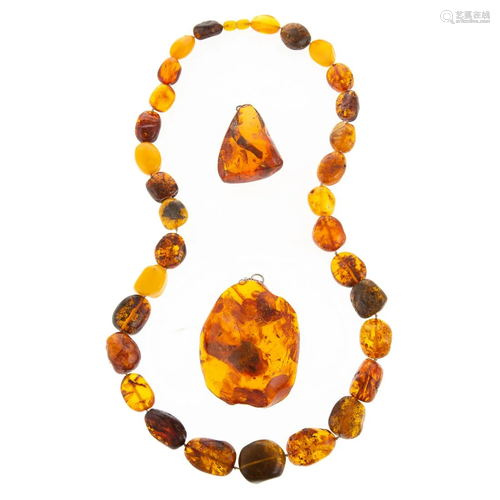 A Graduated Amber Necklace & Two Amber Pendants