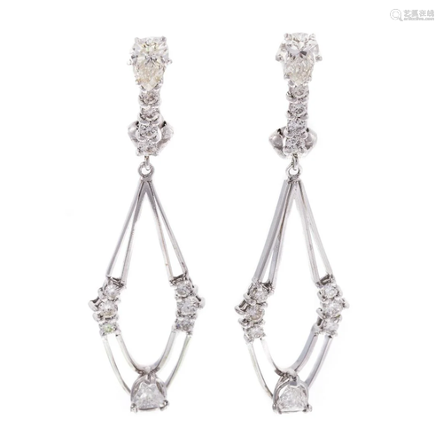 A Pair of Modern Diamond Dangle Earrings in 14K