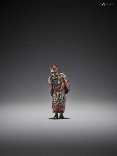 A Lacquered Wood Netsuke Of A …