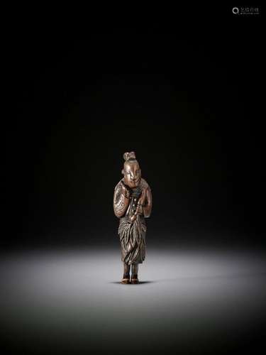 A Tall Wood Netsuke Of Seiobo