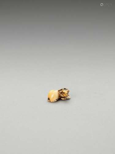 An Ivory Netsuke Of A Recumben…