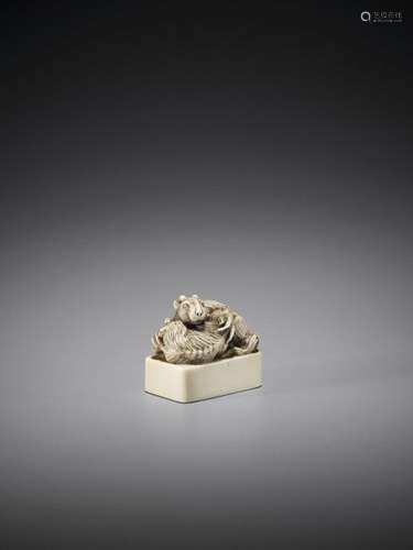 A Fine Ivory Seal Netsuke Of T…