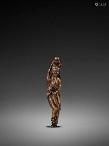 A Large Wood Netsuke Of Gama S…