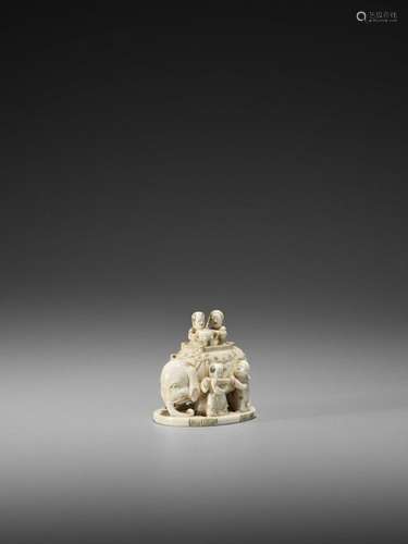 An Ivory Okimono Netsuke Of A …