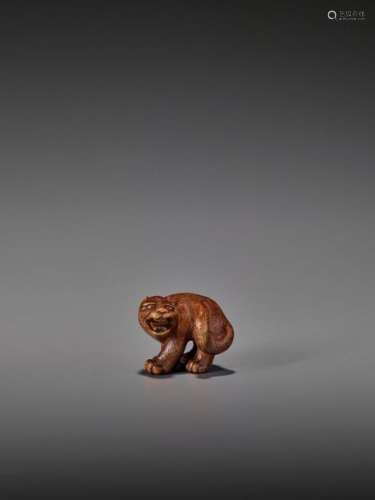 A Rare Wood Netsuke Of A Snarl…