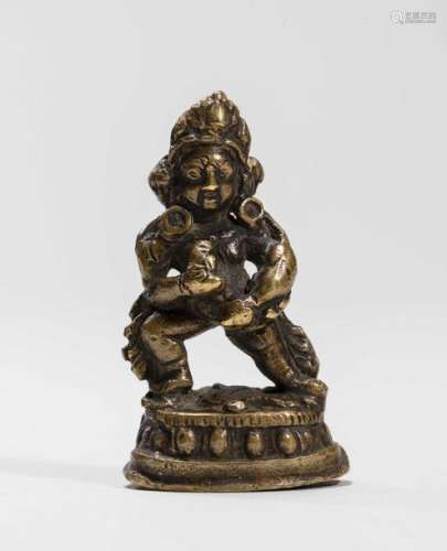 A Tibetan Miniature Bronze Of …