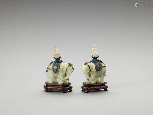 A Pair Of Caparisoned Jade Ele…