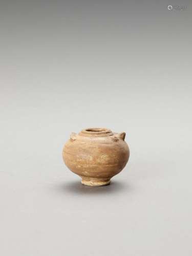 A Small Ceramic Vase In The Fo…