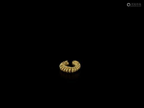A Circular Cham Gold Spiral Ea…