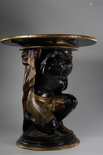 Carved wooden pedestal table representing a Moorish