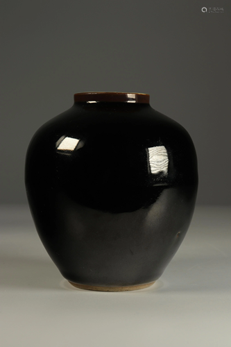 Porcelain vase with monochrome black mirror glaze.