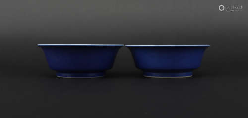 A pair of blue glazed cup