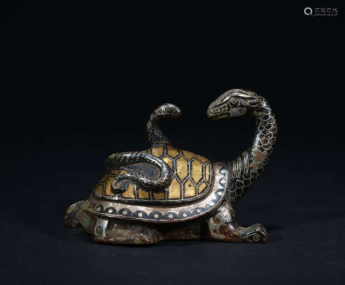 A bronze beast ware with gold and silver