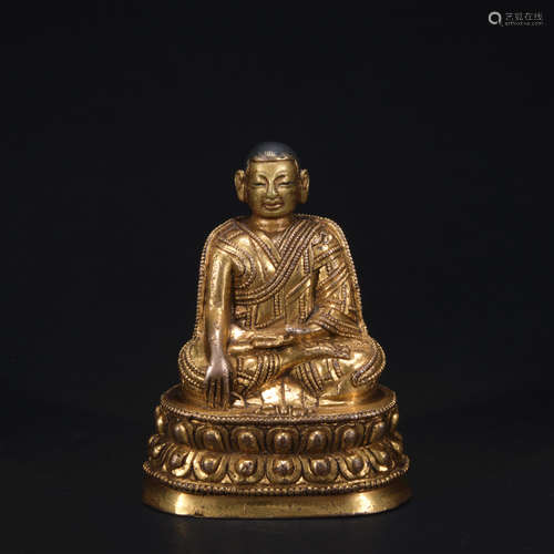 A gilt-bronze figure of Sakyamumi