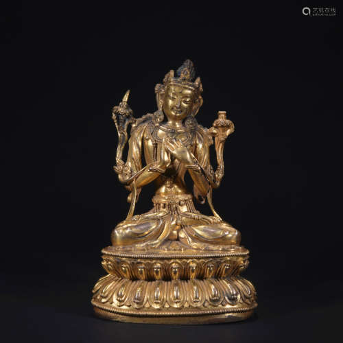 A gilt-bronze figure of Manjusri