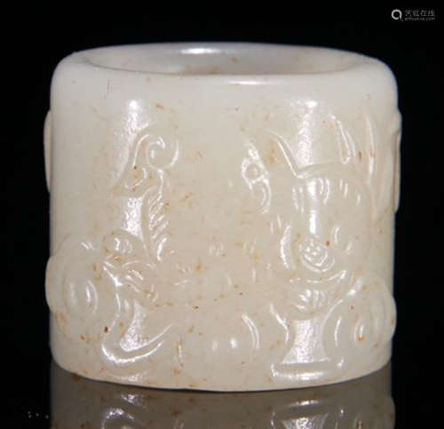 A HETIAN JADE RING CARVED WITH BEAST