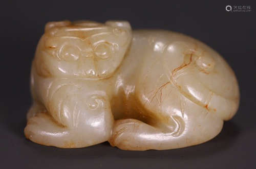 A HETIAN JADE BEAST PENDANT