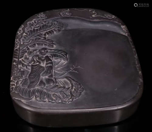 AN INK SLAB CARVED WITH FIGURE