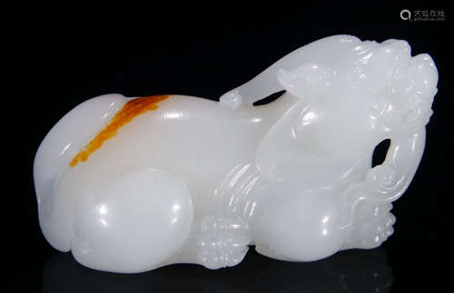 A HETIAN JADE BEAST PENDANT