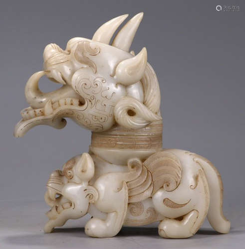 A HETIAN WHITE JADE BEAST ORNAMENT