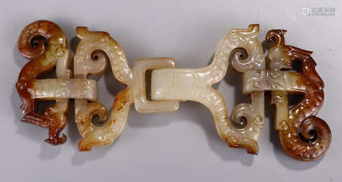 A HETIAN JADE PENDANT CARVED WITH BEAST PATTERN