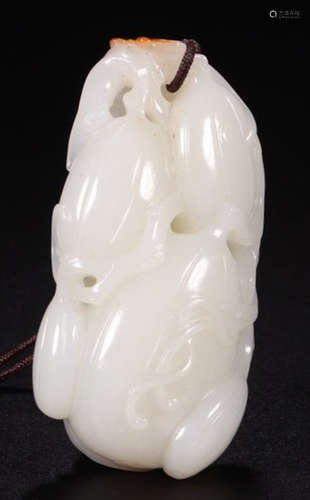 A HETIAN WHITE JADE PENDANT CARVED WITH MELON