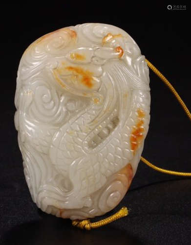 A HETIAN WHITE JADE PENDANT CARVED WITH DRAGON