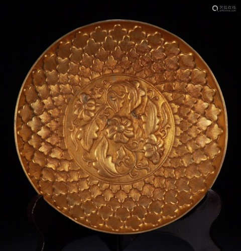 A GILT BRONZE PLATE CARVED WITH FLOWER
