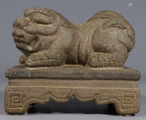 A STONE ORNAMENT SHAPED WITH LION