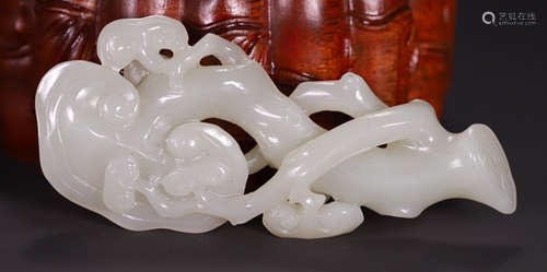 A HETIAN JADE RUYI CARVED WITH GANODERMA