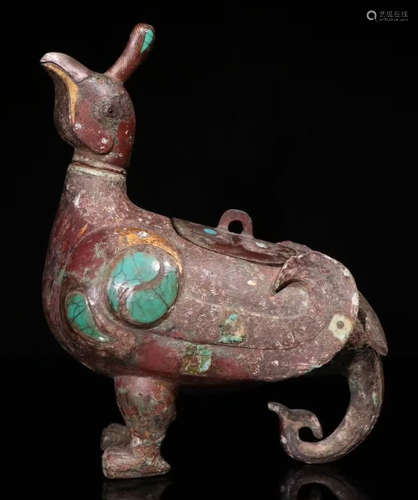 A COPPER ORNAMENT SHAPED WITH BIRD