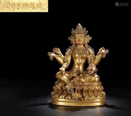 A GILT BRONZE CARVED BUDDHA