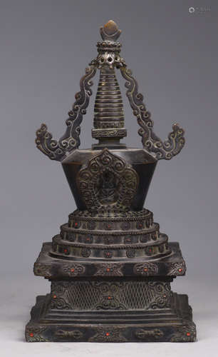 A COPPER PAGODA CARVED WITH PATTERN