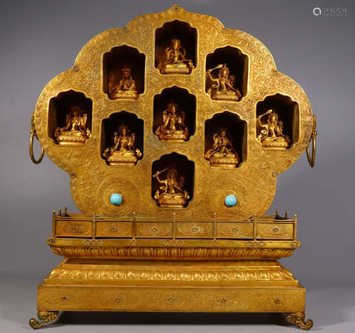 A GILT BRONZE PAGODA EMBEDDED WITH BUDDHA