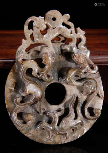 AN ANTIQUE JADE BI CARVED WITH BEAST