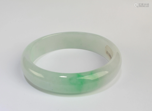 An Oval Shaped Jadeite Jade Bangle with Certificate
