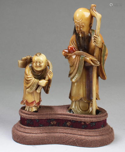 A Group of Two Soapstone Statues