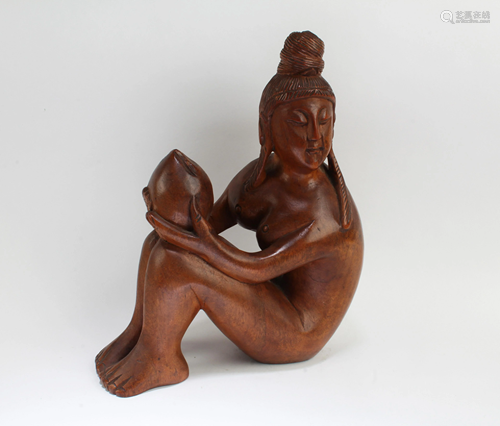 A Carved Hardwood Figurine