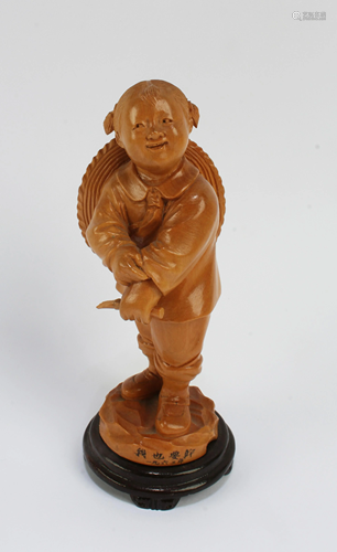 A Carved HuangYangMu Figurine