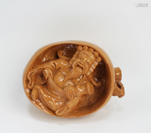 A Carved HuangYangMu Figurine