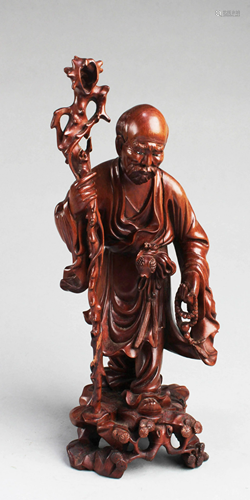 A Carved Wooden Figurine