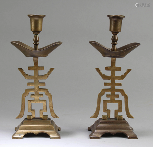 A Pair of Chinese Bronze Candle Holders