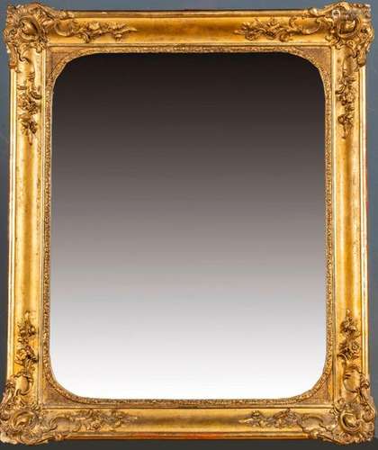 MIRROR \nCarved and gilded wood and stucco frame wi…