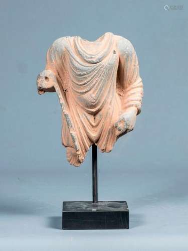 Headless torso in its pleated monastic toga \nof Bu…