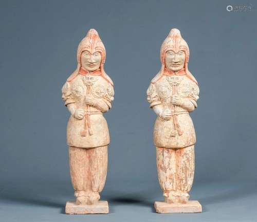 Two warriors standing in armour, in \nterracotta wi…